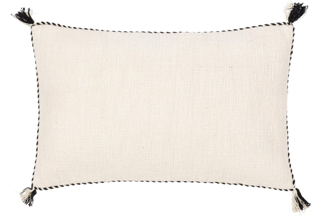 White pillow outlet with tassels