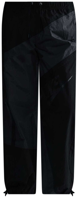 Nike Sportswear Pants de tejido Woven de tiro medio holgados con dobladillo abierto para mujer